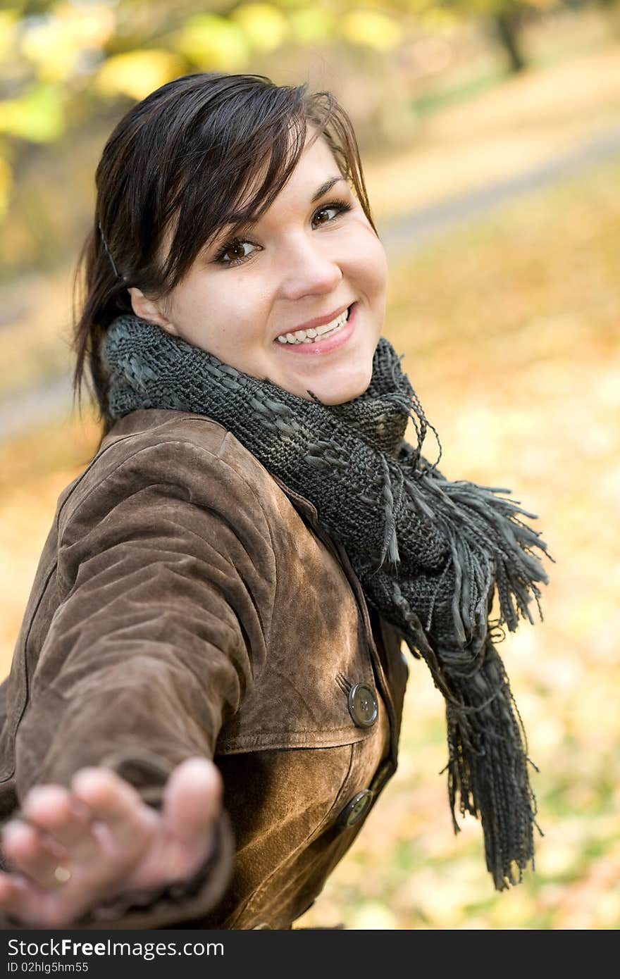 Attractive brunette woman happy at park. Attractive brunette woman happy at park