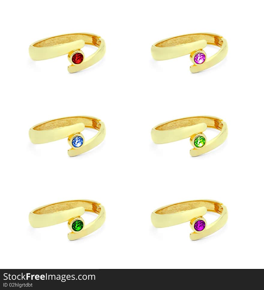 Golden ring with various gem stones isolated