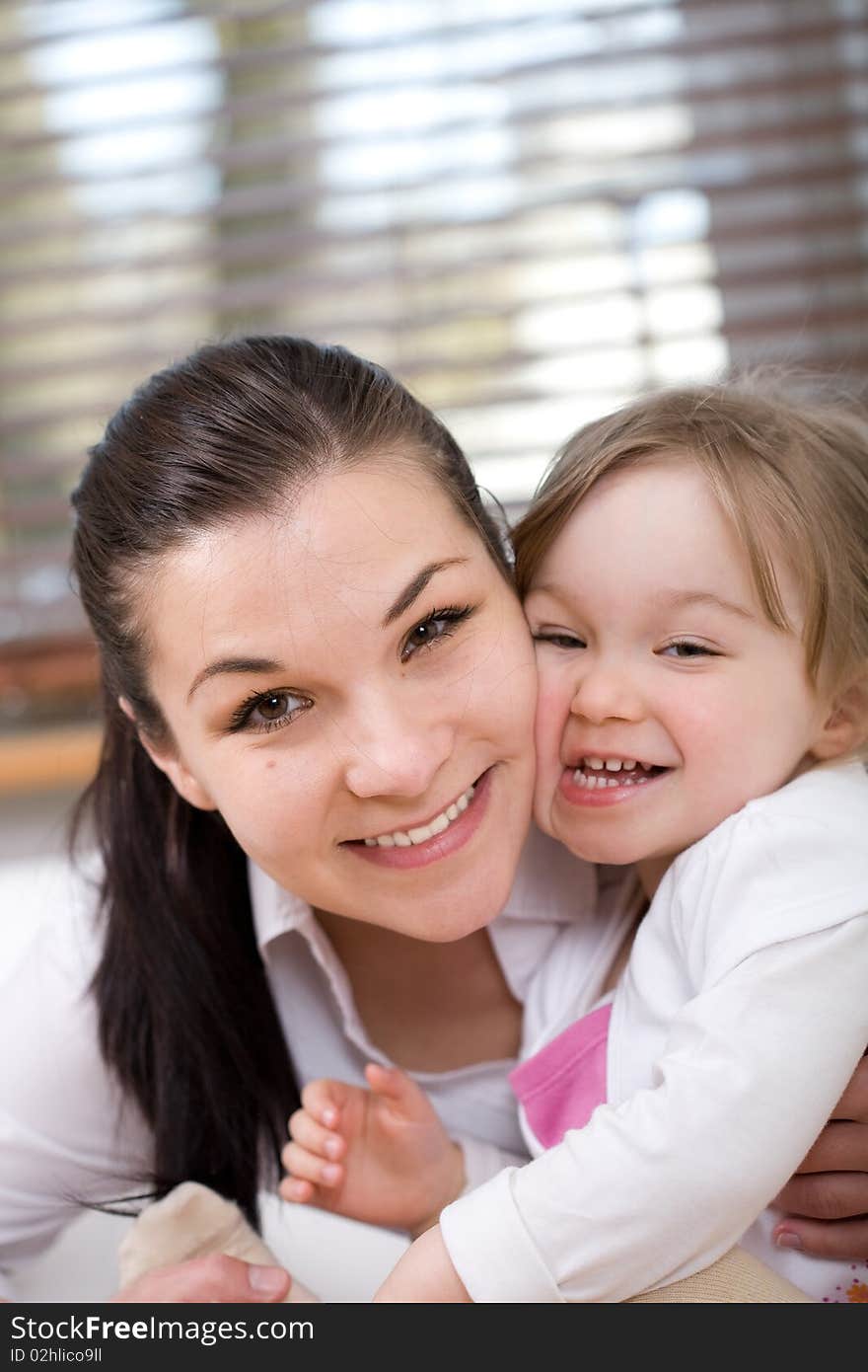 Mother and daughter having fun on sofa. Mother and daughter having fun on sofa