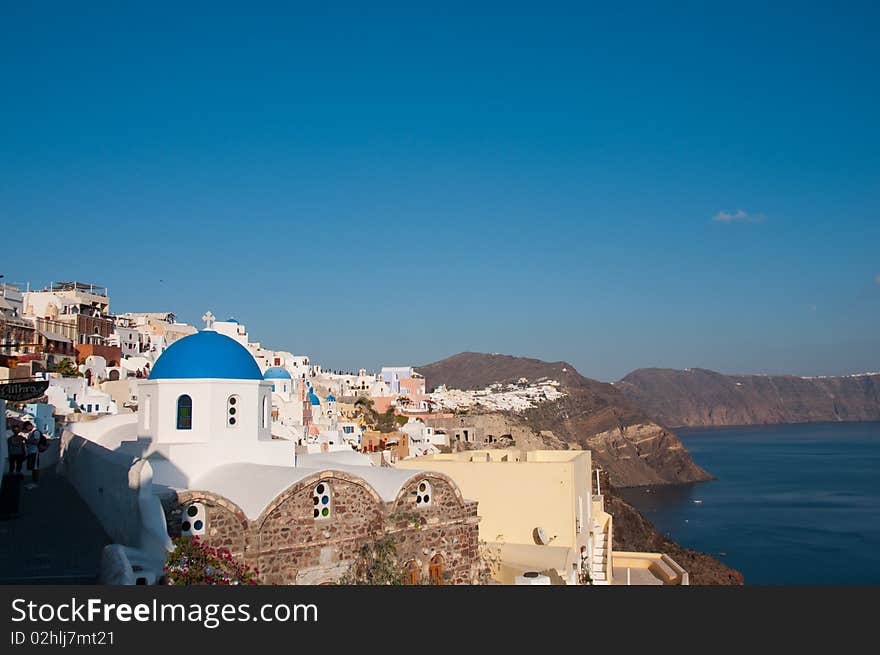 Greek church in santorini greece with a cross