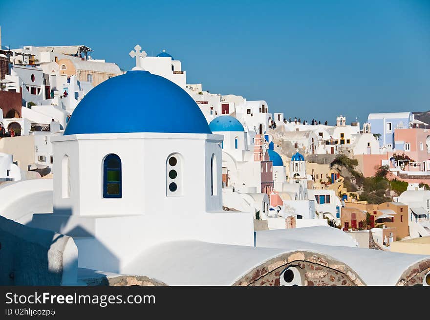 Greek church in santorini greece with a cross