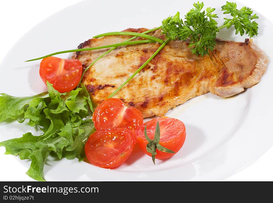 Meat with fresh vegetables and salad