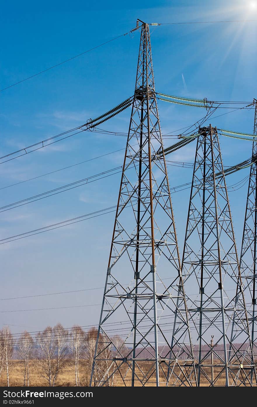 High voltage electricity power towers closeup