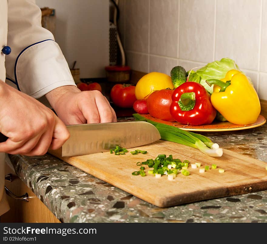 Cook chopped onion on a wooden board