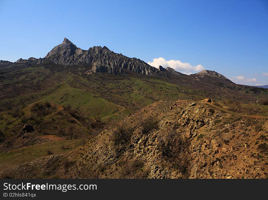 Mountain landscape with yellow and green grass. National park karadag