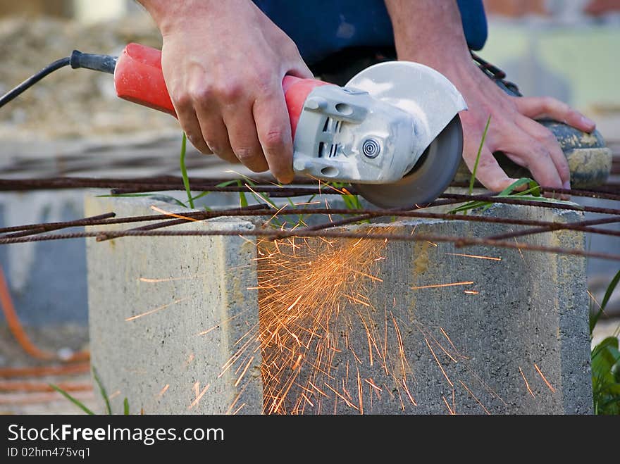 Man working with handtool on construction site. Man working with handtool on construction site