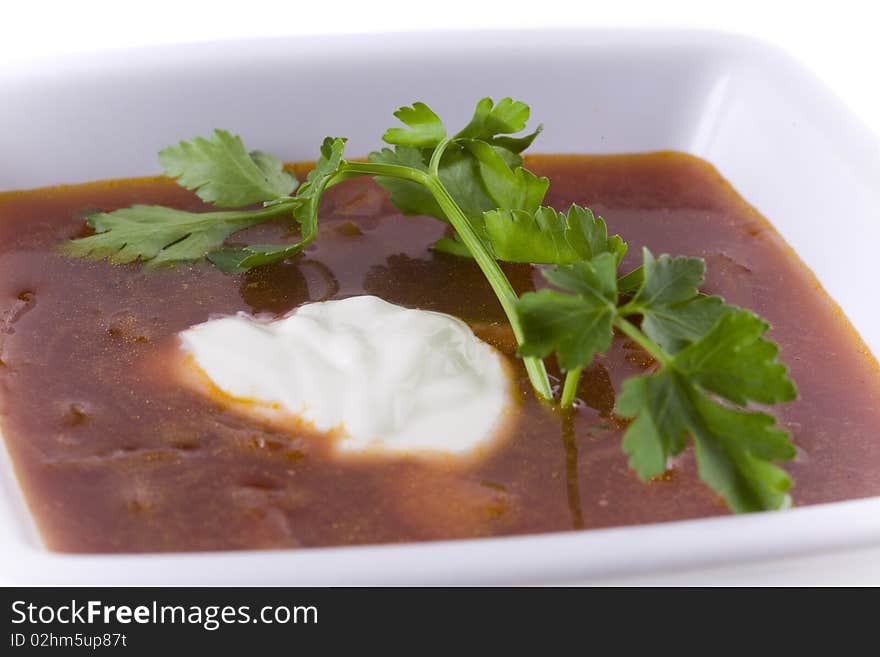 Borscht in white bowl isolated on white. Borscht in white bowl isolated on white