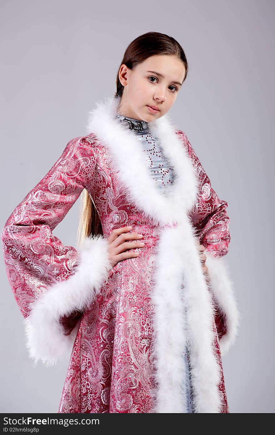 Portrait of a beautiful young girl in russian national costume