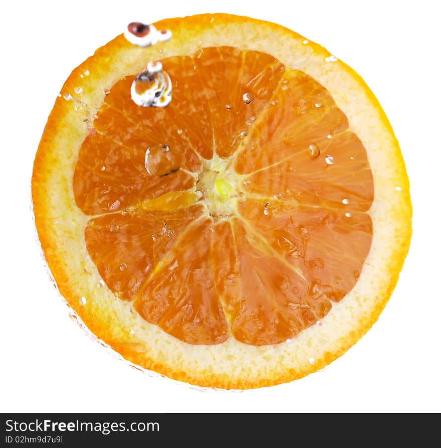 Half of an orange, splashed with clear water. Isolated on a white background. Half of an orange, splashed with clear water. Isolated on a white background.