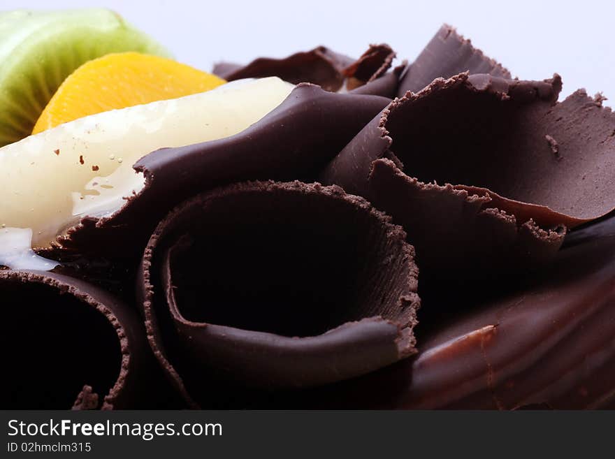 Fruit chocolate cake on a white background