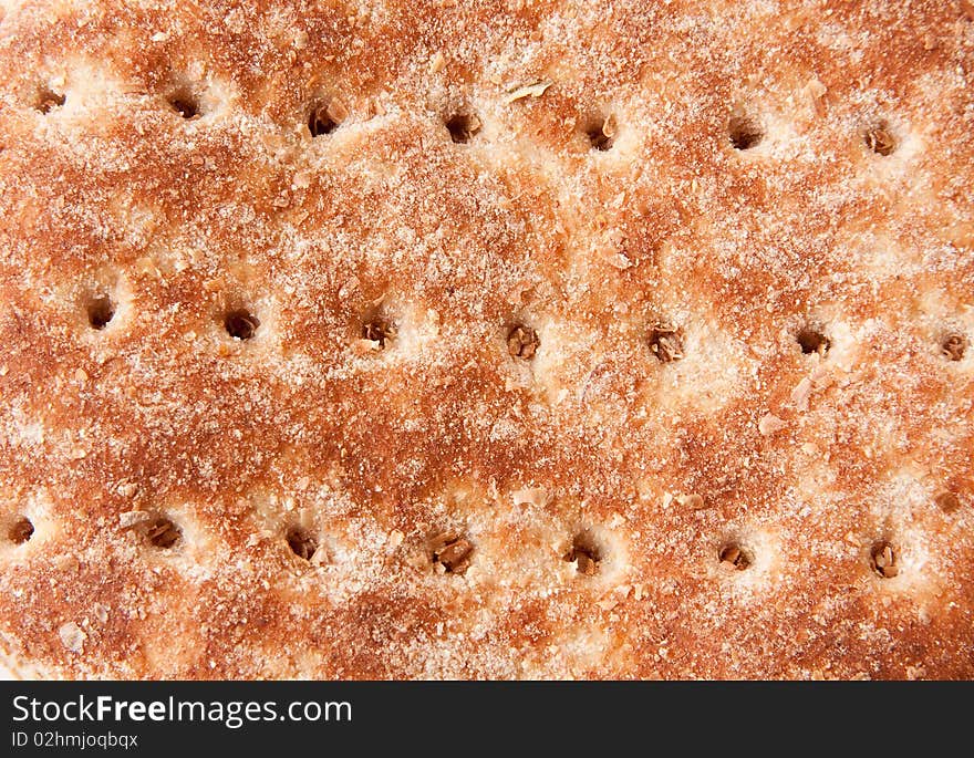 Closeup of top of bread bun, showing texture and holes in a horizontal pattern. Closeup of top of bread bun, showing texture and holes in a horizontal pattern