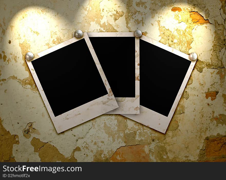 Three empty grunge frame for your photo on the old wall with lighting