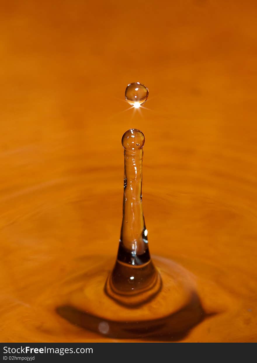 Water drop on orange background