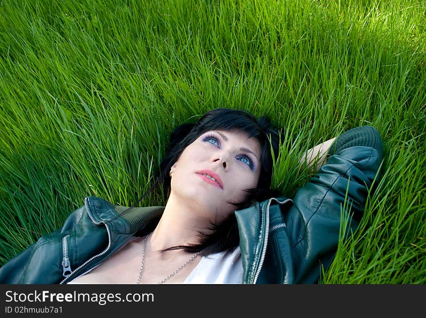 Young model laying in the grass. Young model laying in the grass