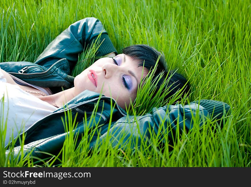 Young model laying in the grass. Young model laying in the grass