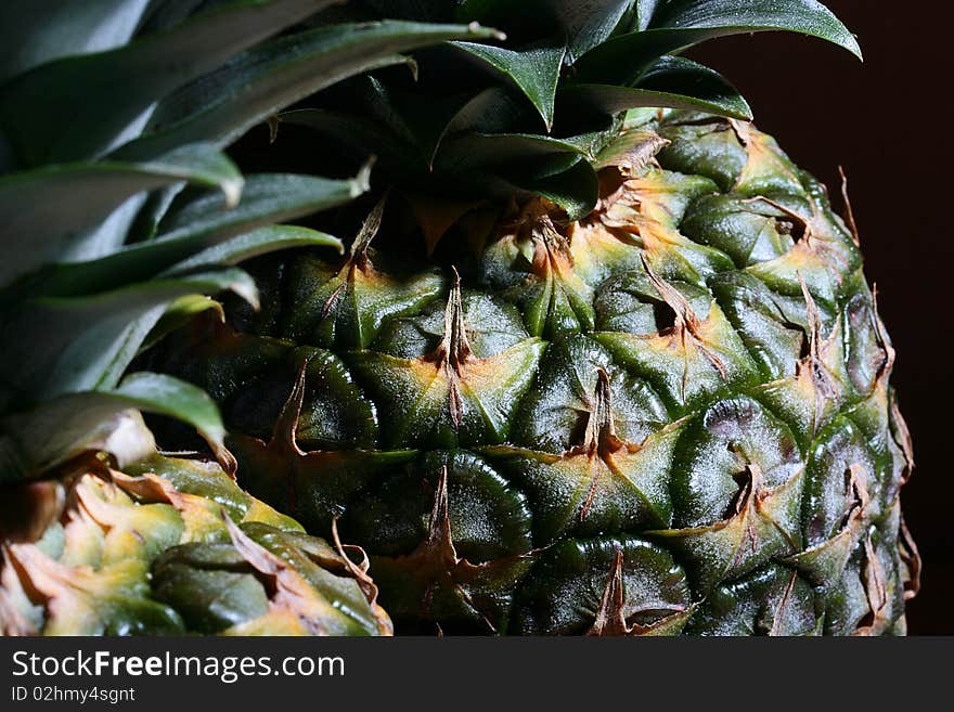 Pineapples from tropics a close up, a background black.