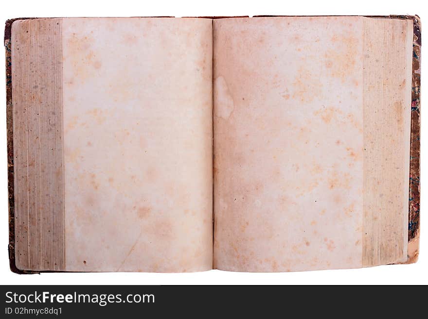 The thick ancient book with blank pages, is opened in the middle.