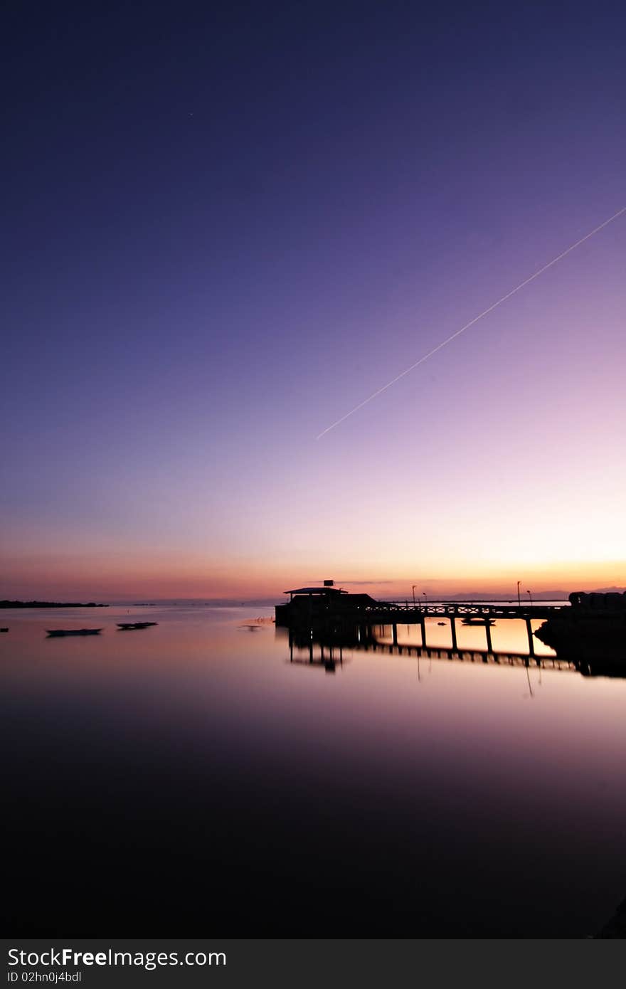 A photo that shows the calmness of the place, an airplane flies by showing it as a streak of light. A photo that shows the calmness of the place, an airplane flies by showing it as a streak of light