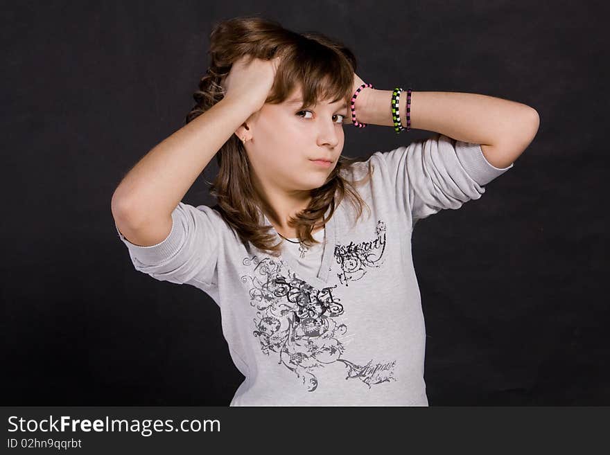 Portrait of teenage girl on a black background. Portrait of teenage girl on a black background