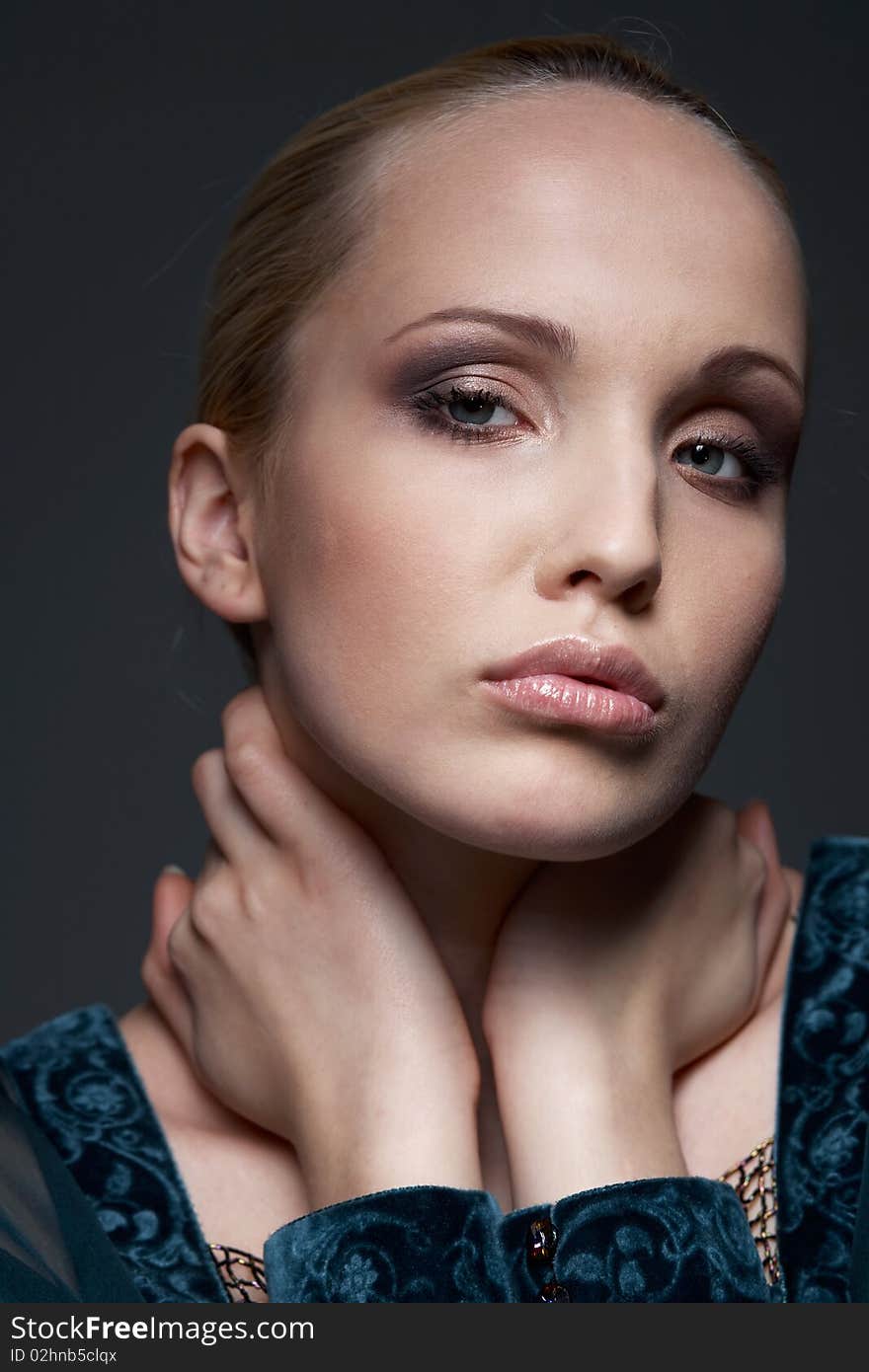 Close-up portrait of a beautiful model, posing, in vintage style. Close-up portrait of a beautiful model, posing, in vintage style.