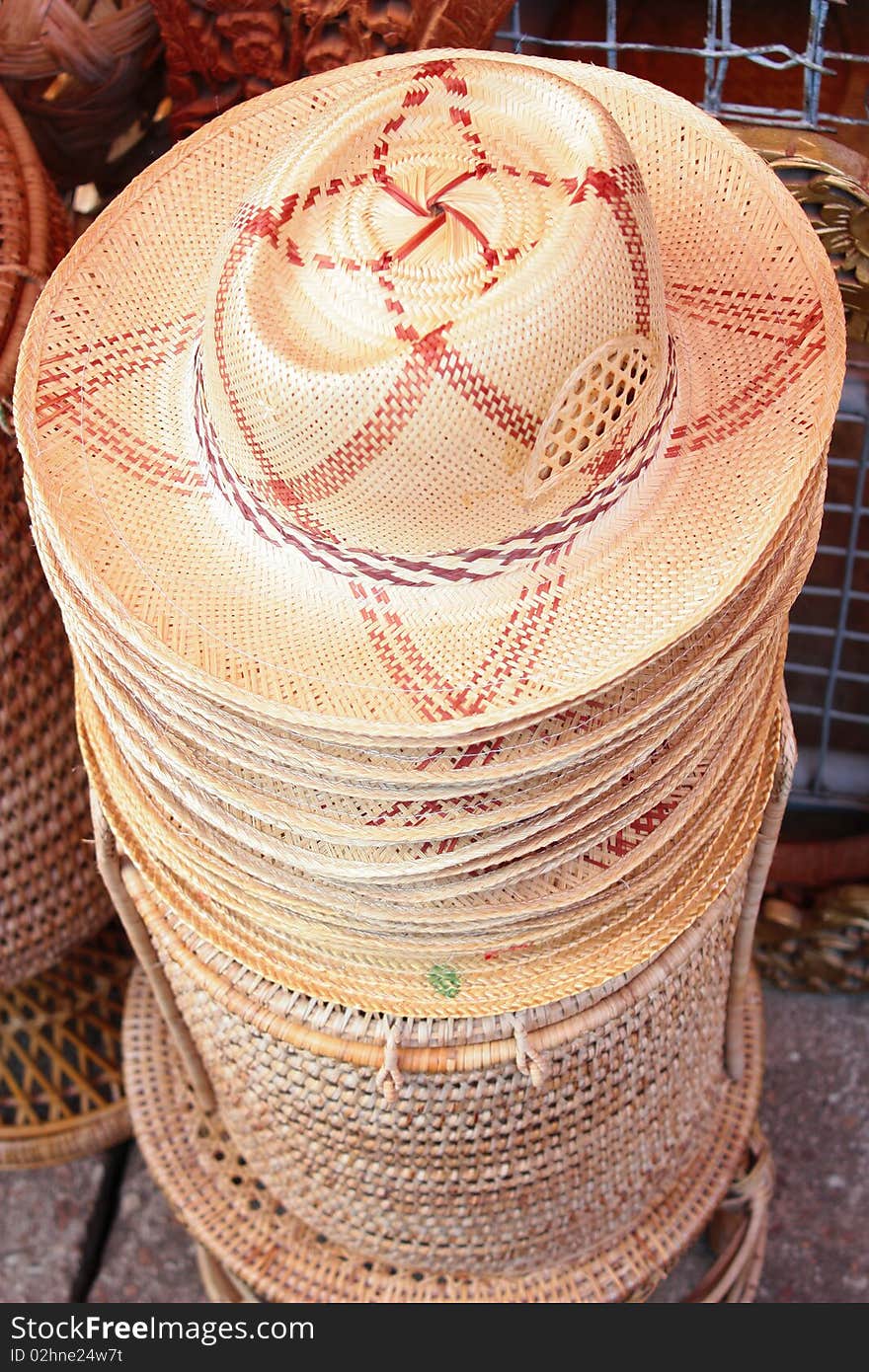 Handmade wooden entwined seats piled up on top of each other. Handmade wooden entwined seats piled up on top of each other.