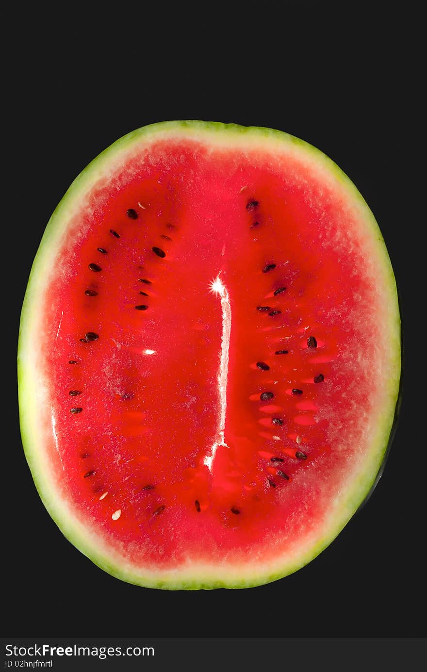 Big red watermelon isolated on black  background. Big red watermelon isolated on black  background