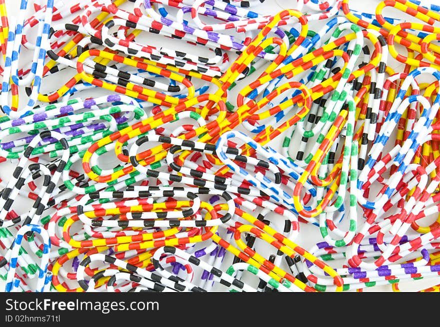 Colored paper clips on the entire background