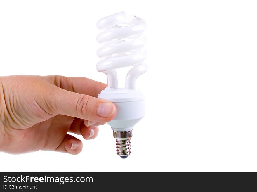 Energy-saving lamp in a hand on a white background