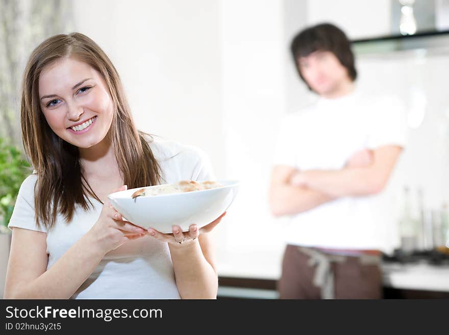 Beautiful girl with plate and boy