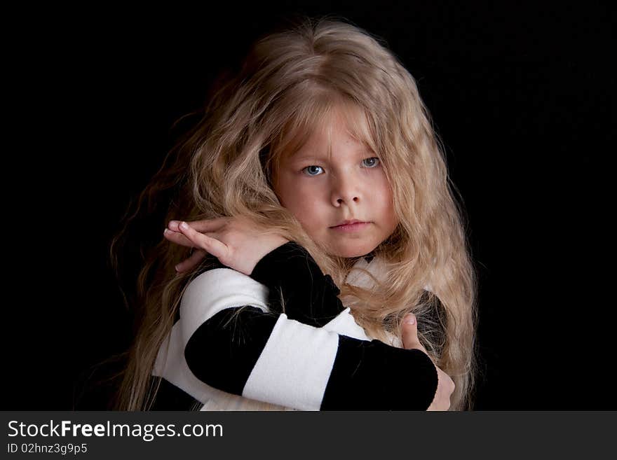 Beautiful little girl with long hair and refined manners. Beautiful little girl with long hair and refined manners