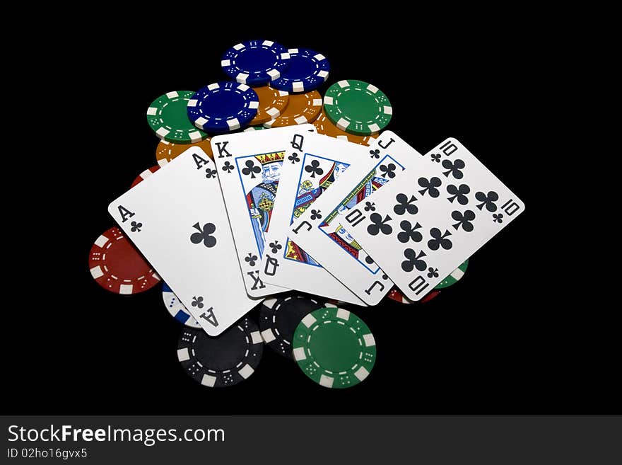 Hand of card player with royal flush and chips. Hand of card player with royal flush and chips