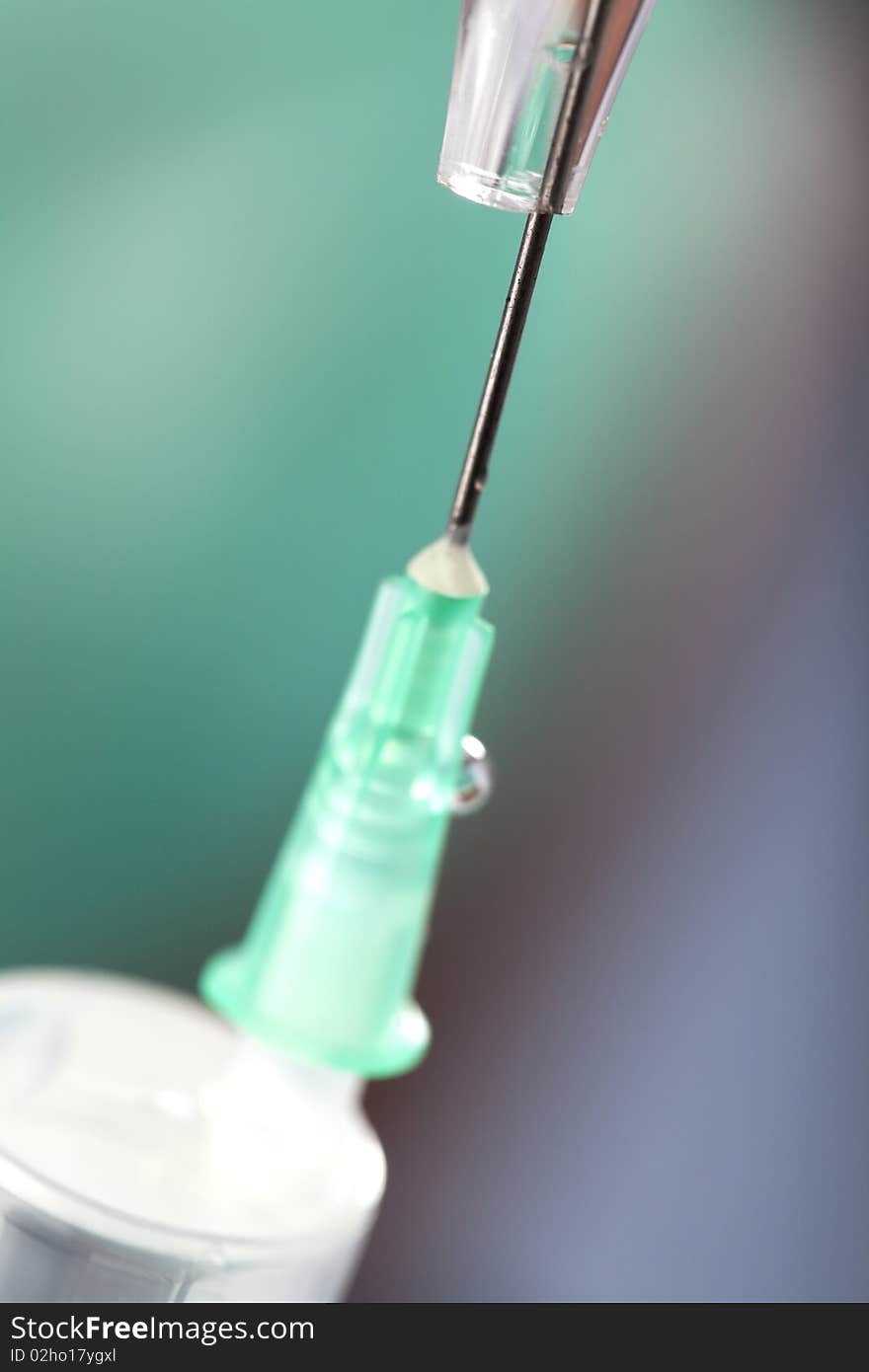 Doctor holding syringe and getting ready for injection