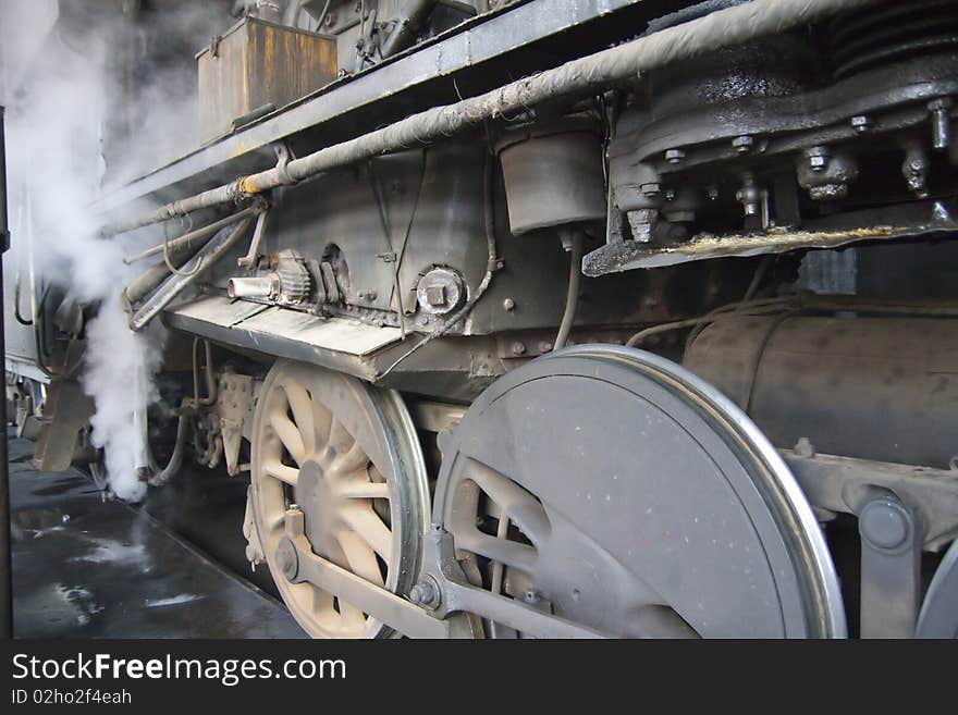 The wheels of the old-fashioned steam locomotive. The wheels of the old-fashioned steam locomotive