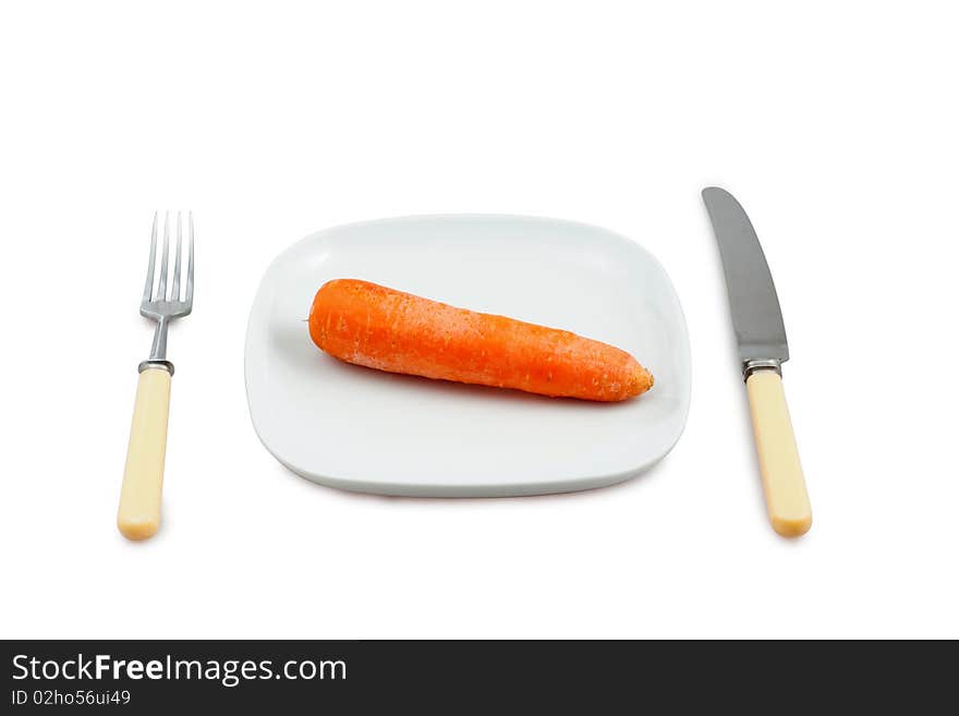 Knife, plug and plate with carrot on white background. Knife, plug and plate with carrot on white background