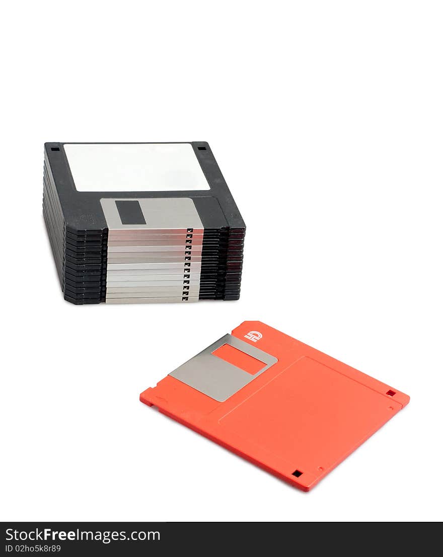 Stack of black floppy disks and one red