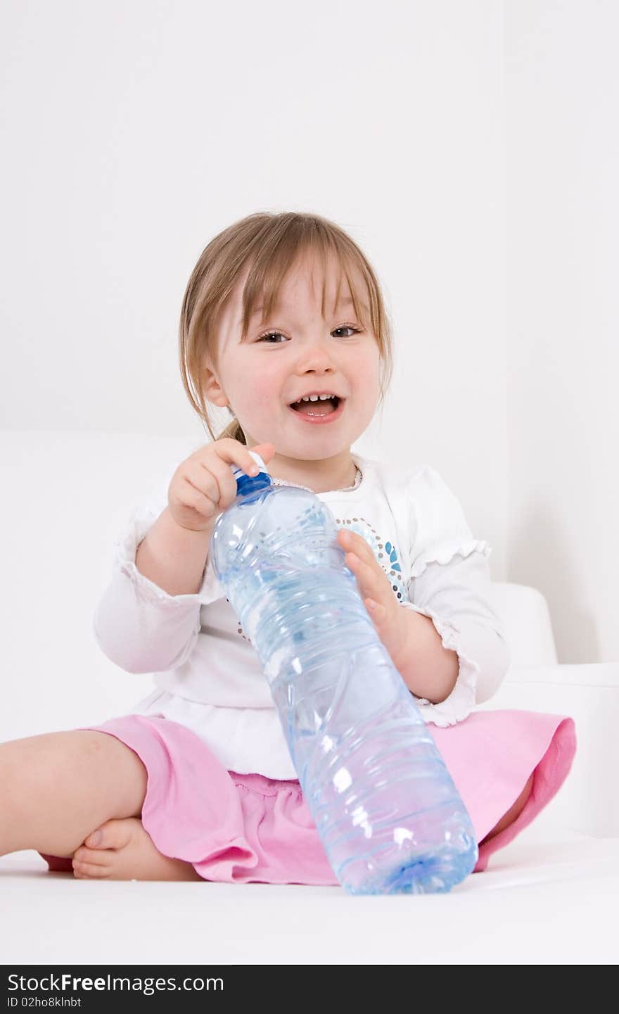 Happy little girl with water. Happy little girl with water