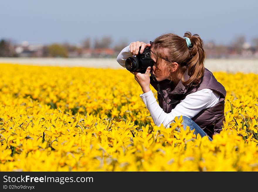 Girl making pictures of flowers