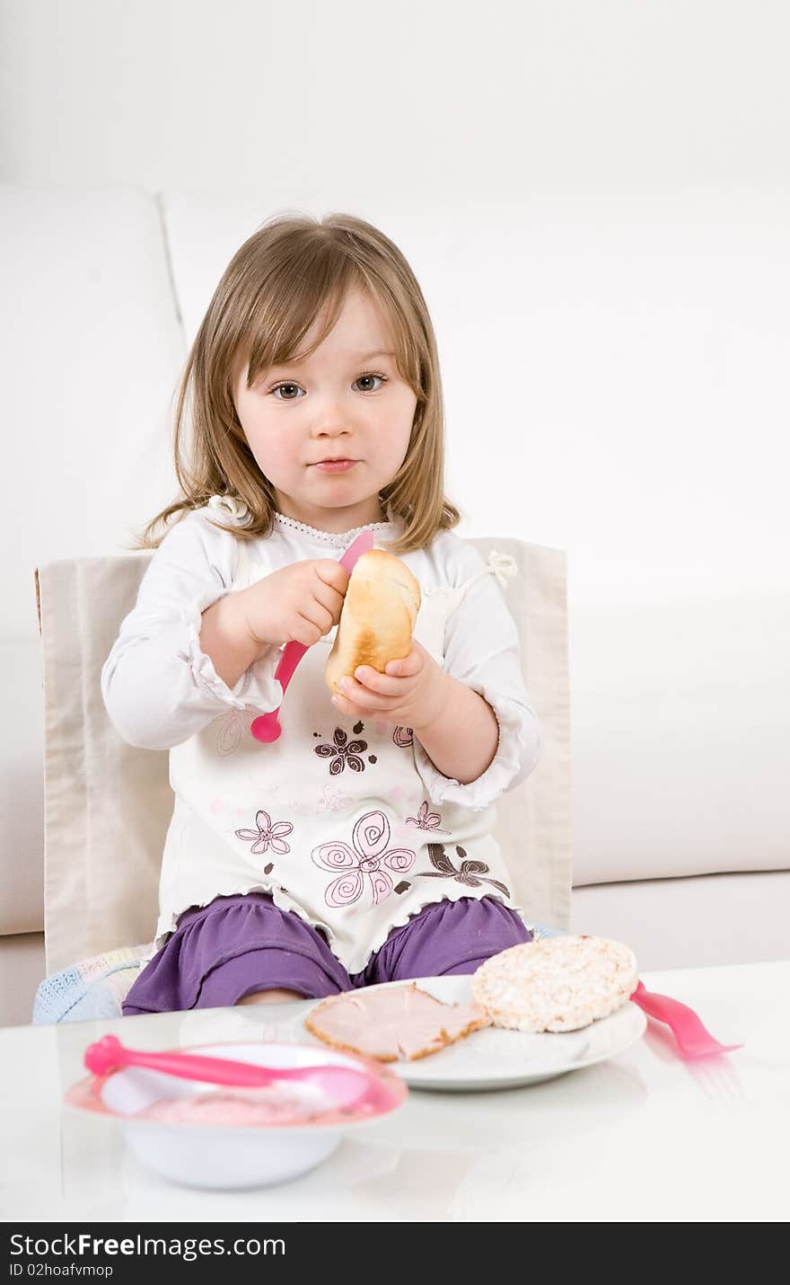 Sweet toddler little girl eating