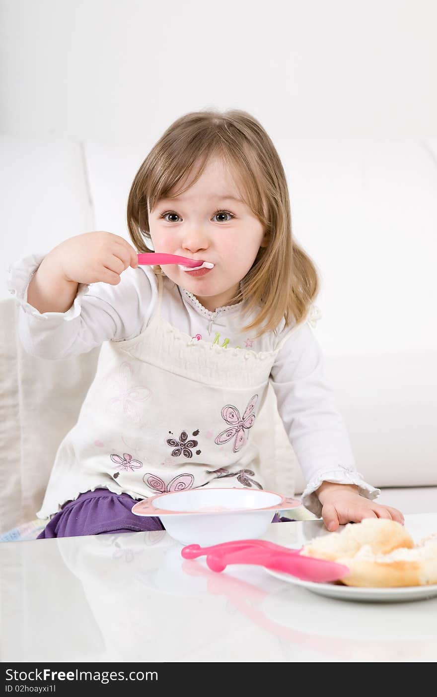 Sweet toddler little girl eating