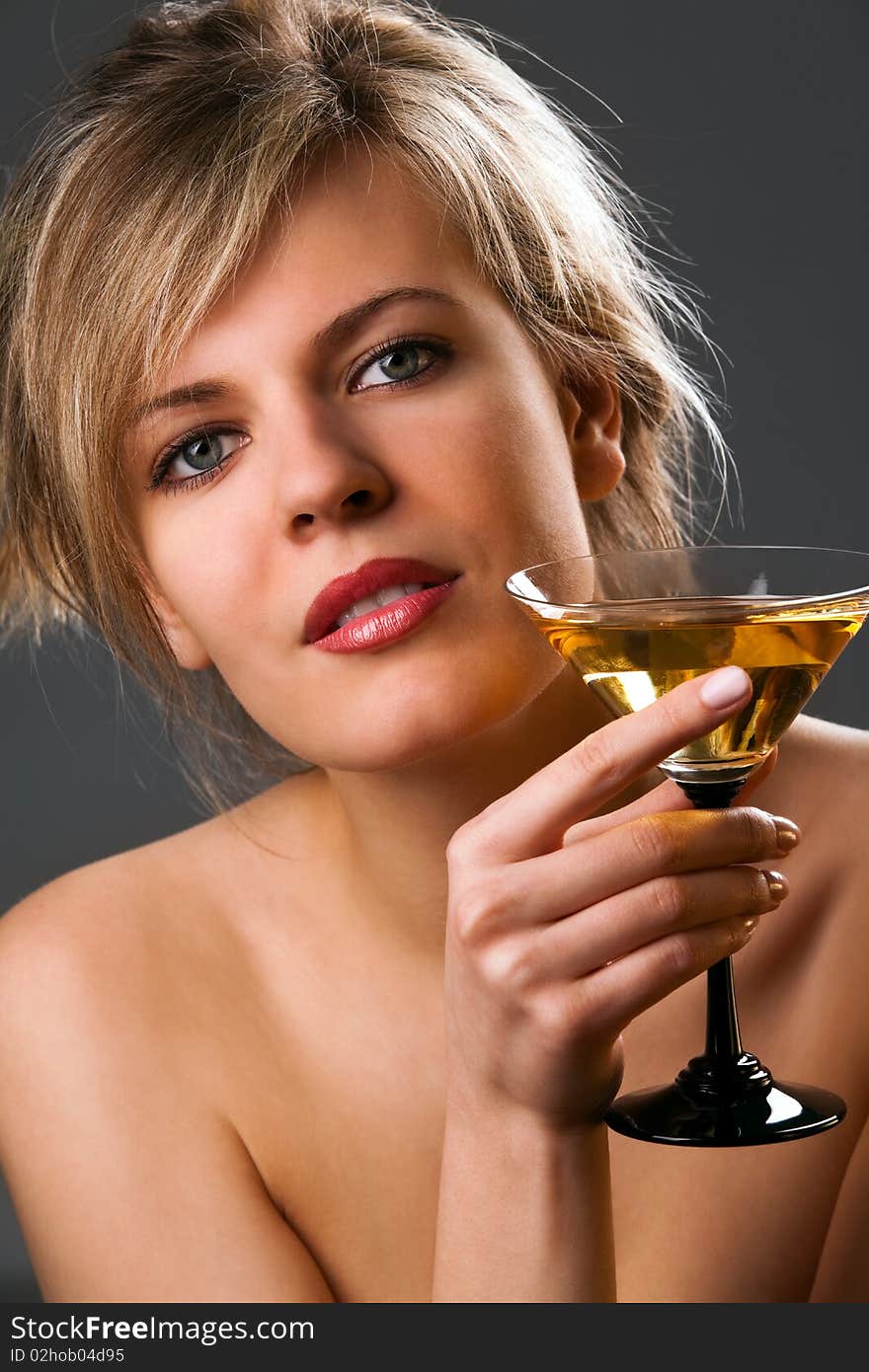 Woman with glass of cocktail