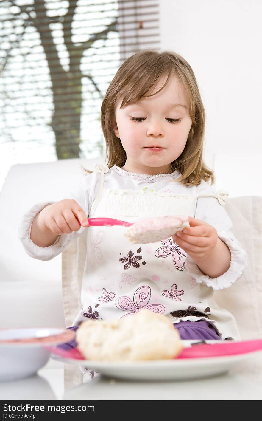 Sweet toddler little girl eating