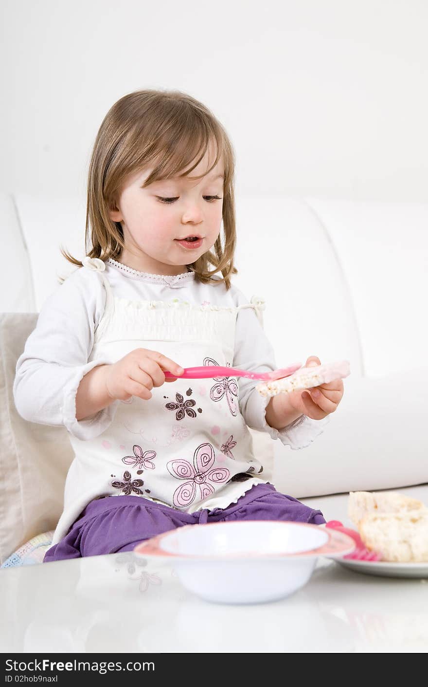 Sweet toddler little girl eating