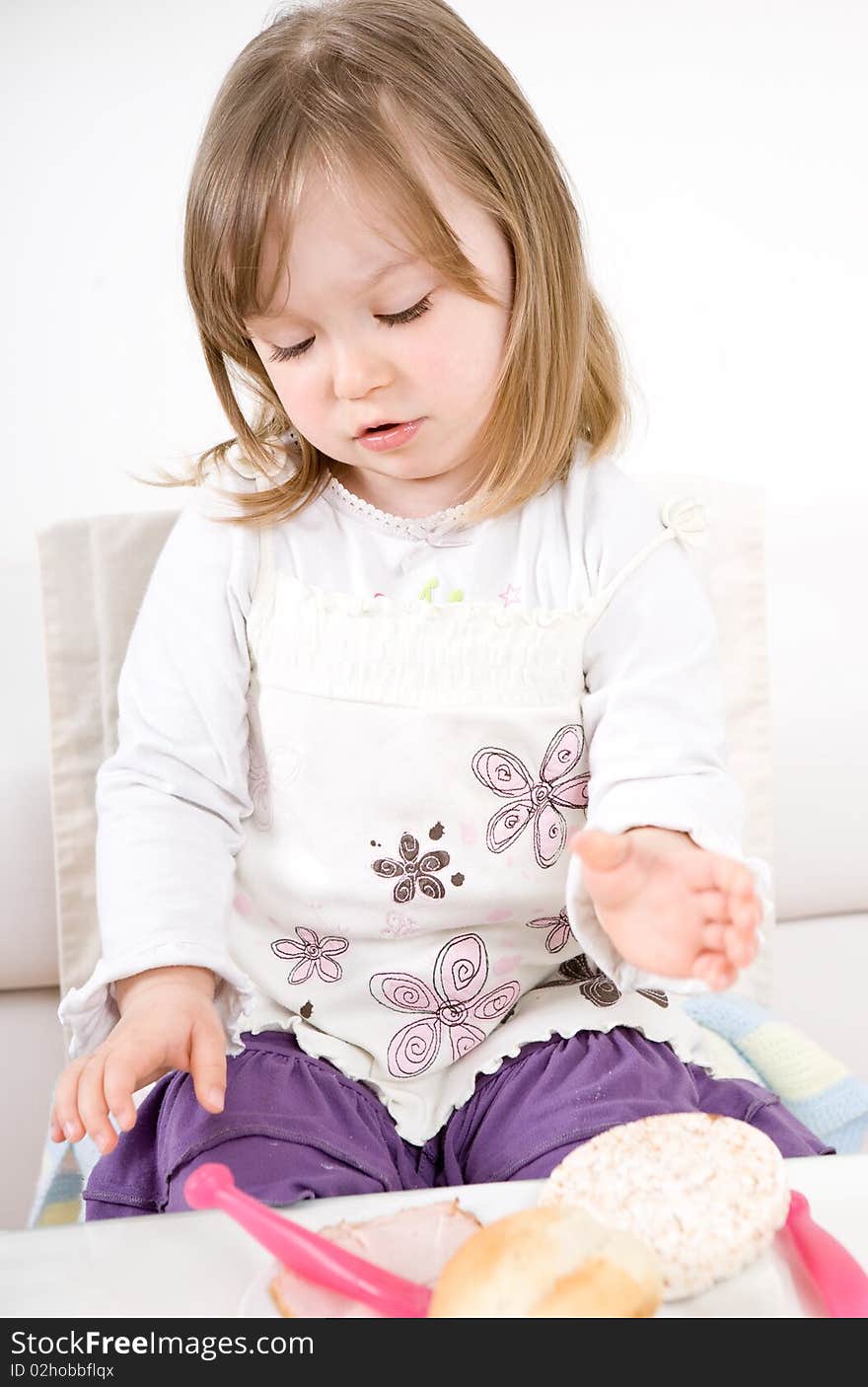 Sweet toddler little girl eating