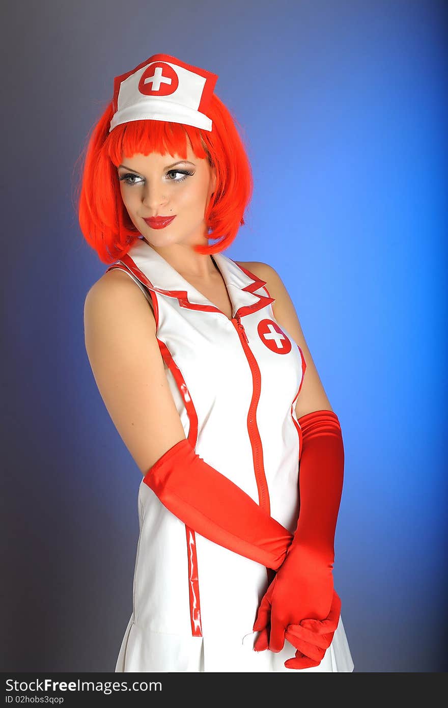 Young nurse with red hair. blue background. Young nurse with red hair. blue background