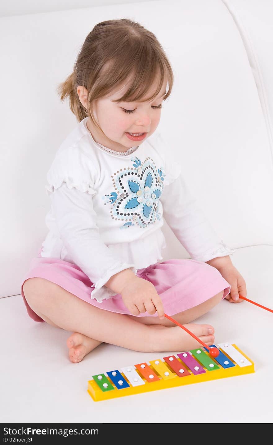 Little girl with instrument