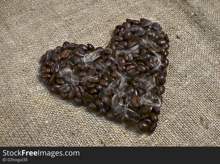 Roasted coffee beans in the shape of the heart. Roasted coffee beans in the shape of the heart.