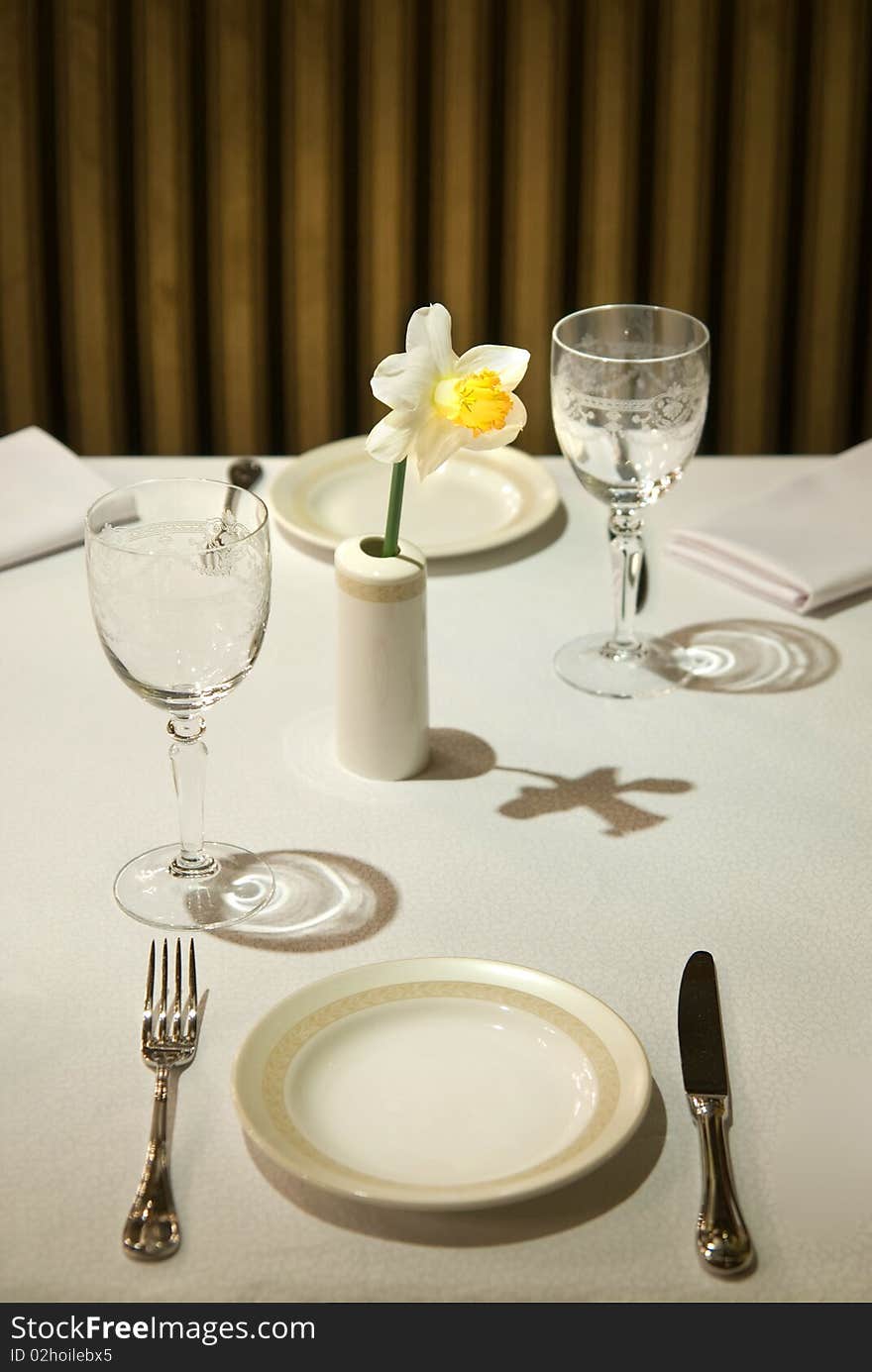 Photo of served table in restaurant with flower