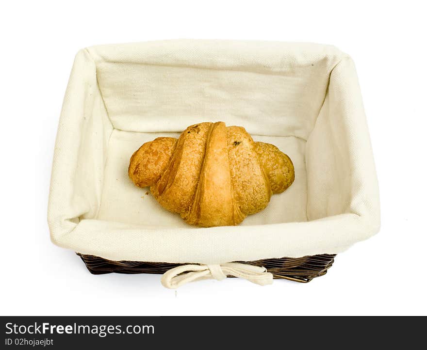 Resh bread rolls in a basket on white