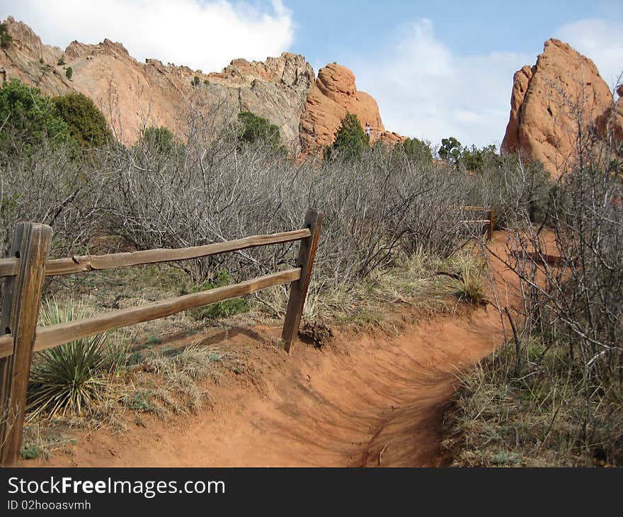 The beautiful walkways and gates along trails of The Garden of the gods in Colorado. A popular National Park visited by millions of people. A favorite among hikers and rock climbers along with walkers .