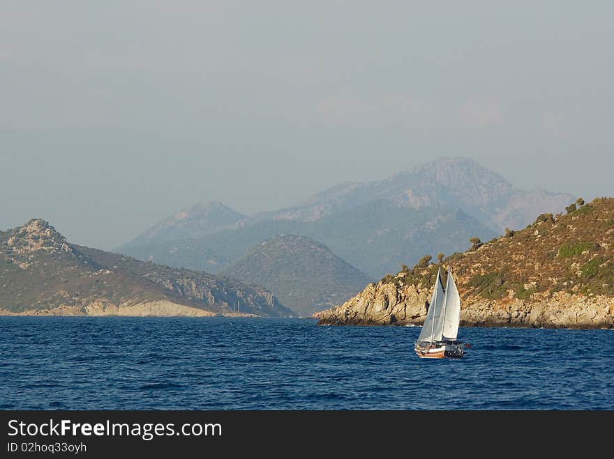 The sailing vessel goes on the sea to coast. The sailing vessel goes on the sea to coast.